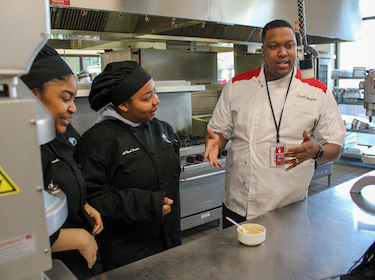 Jermayne Harris with students